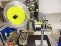 Machine for measuring length and winding a textile band